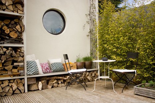 outdoor dining area seaing round window outdoor dining area seaing round window
